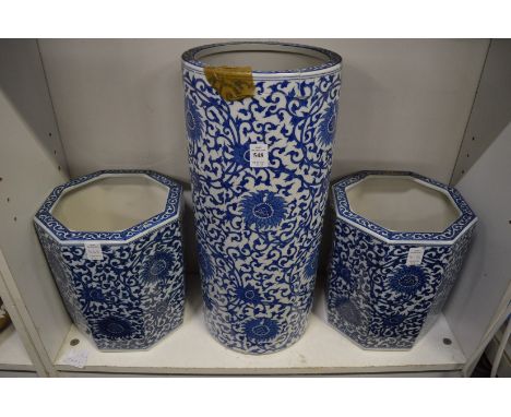 A Chinese blue and white stick stand and pair of matching jardinieres (stick stand damaged).