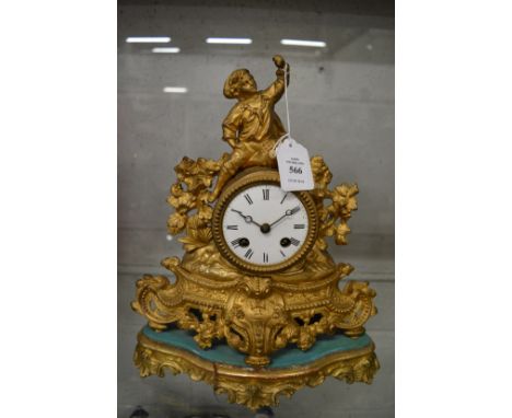 A French ormolu mantel clock and stand.
