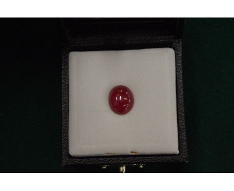 A natural cabochon oval ruby gemstone with certificate.