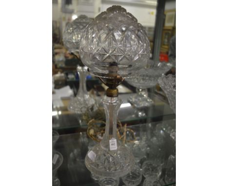 A cut glass table lamp and shade.