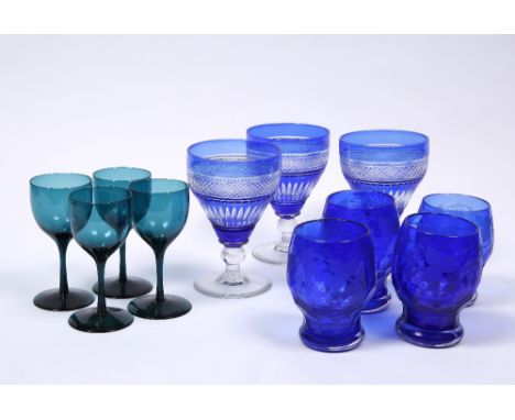 Three blue overlaid wine glasses four etched wine tumblers and a set of four Bristol green glass glasses