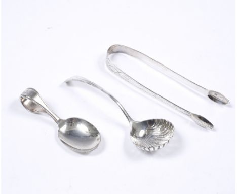 A pair of Georgian silver sugar nips with bright-cut decoration together with a silver casting spoon and a silver plated cadd