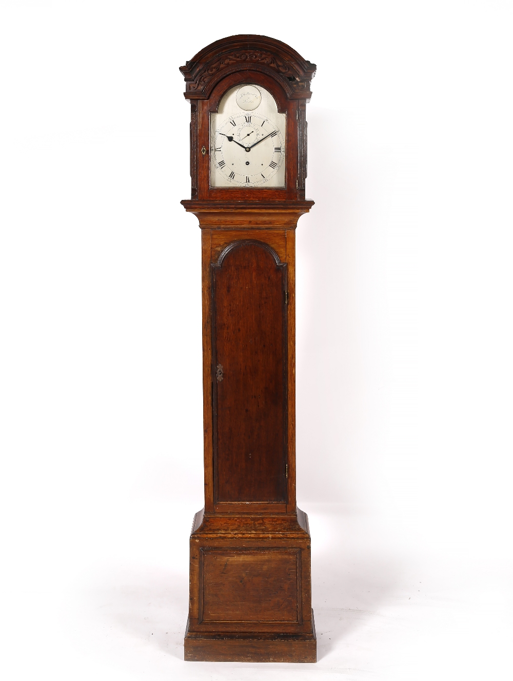 An oak small longcase clock with arched silvered dial marked John Moore ...