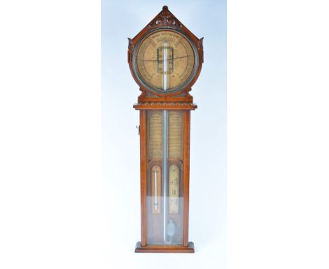 A Victorian oak framed barometer The Royal Polytechnic with supplementary thermometer and applied decoration, 104cm tall