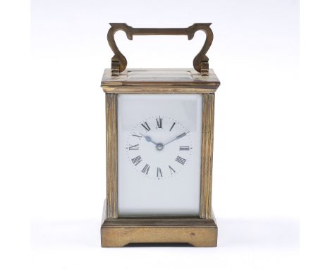 A French brass carriage clock with enamel dial and loop handle (with presentation inscription)