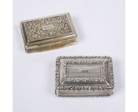 Two silver vinaigrettes  of rectangular form with relief and engine turned decoration and gilt and pierced interiors, Birming