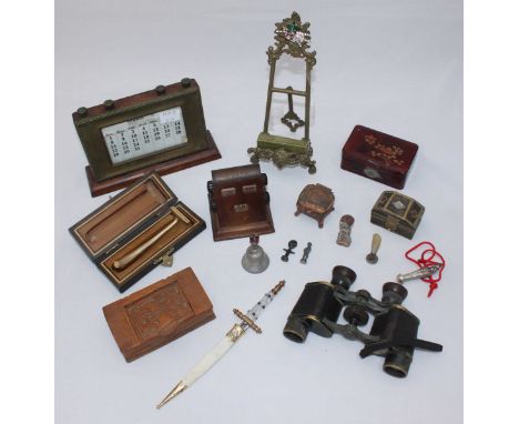 Two wooden desk calendars, a brass table easel, pair of early 20th binoculars and other collectables