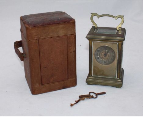 A 19th century brass carriage clock, the five glass case exposing platform escapement and the brass dial with Arabic numerals