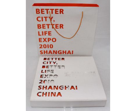 Three albums containing several hundred stamps and approximately 1500 loose world stamps, a Shanghai 2010 expo boxed set of w