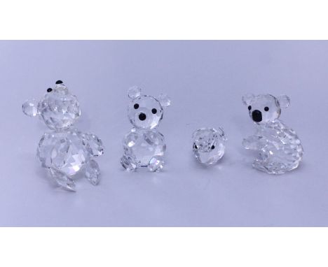 Four assorted Swarovski crystal figures of animals including a koala and a bear etc.