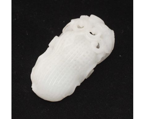 A Chinese carved jade peanut with a stylized cat atop. 8cm long.