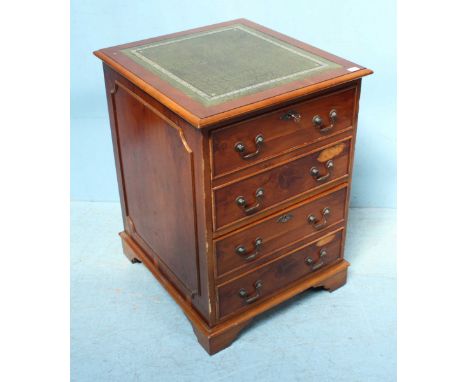 A 20th century walnut filing cabinet of two deep drawers, the top with silver gilt tooled, green leather scribe and raised on