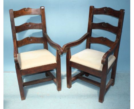 A set of eight William Sheppee hardwood standard dining chairs with scrolling ladder-backs and stuff-over seats, including tw