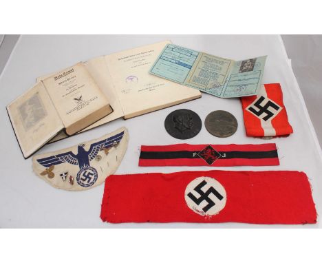 A small collection of Nazi memorabilia comprising, Adolf Hitler 1889-1939 circular profile portrait plaque, 90mm diam, Fliege