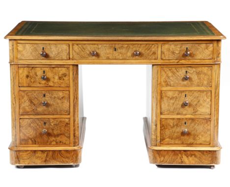 A Victorian walnut twin pedestal desk, the top with a moulded edge and inset with a later gilt tooled leather writing surface