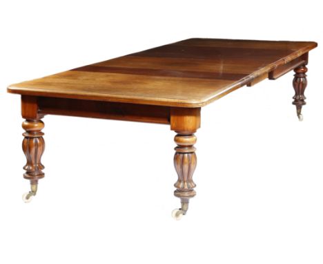 An early Victorian mahogany dining table, the top with a moulded edge, extending to accommodate four additional leaves, suppo