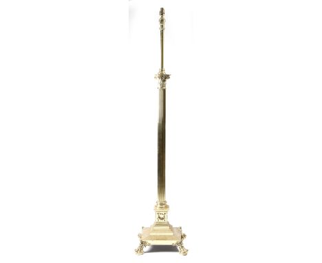 A brass Corinthian column standard lamp, with a stepped base and claw and ball feet, late 19th / early 20th century, 170.6cm 