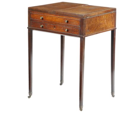 A George III mahogany gentleman's dressing table, the hinged top revealing a fitted interior with four lidded compartments an