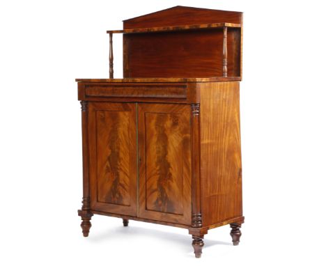 A William IV mahogany chiffonier, with an architectural raised back, with turned baluster supports, above a moulded frieze dr