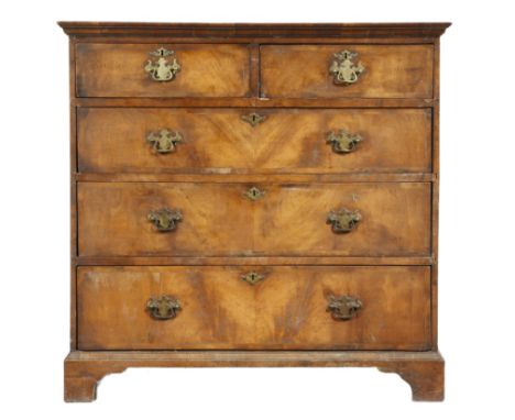A walnut chest, the crossbanded top above two short and four long conforming drawers, on bracket feet, 95.2cm high, 97.7cm wi
