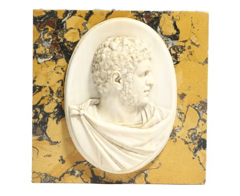 λ A 19th century Italian ivory Grand Tour portrait bust of the Roman Emperor Caracalla, carved in relief, 8.2 x 6cm and mount