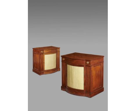 A pair of George III 'Hepplewhite' mahogany breakfront side cabinets, each with a reeded edge top, above a frieze drawer and 