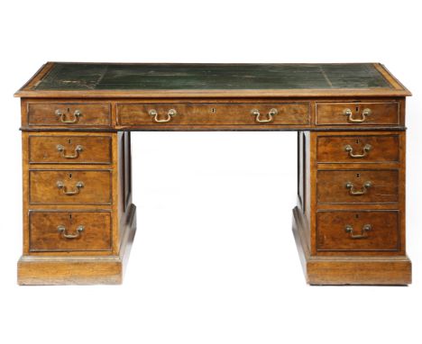 λ A Victorian burr oak and ebonised twin pedestal partner's desk, the crossbanded top with rosewood banding and inset with a 