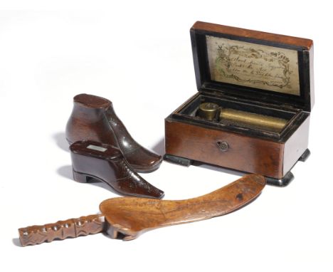 Two 19th century treen snuff shoes, one with brass tack decoration, both with sliding covers, together with a treen goose win