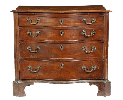 A George III mahogany serpentine chest, the top with a moulded edge above a brushing slide and four long graduated drawers, f