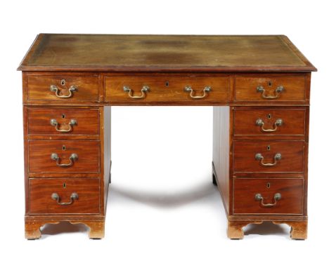 An early 19th century mahogany twin pedestal partner's desk, the top inset with a later gilt tooled leather writing surface, 