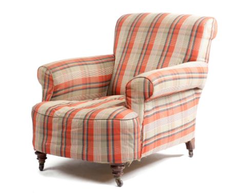 A late Victorian easy armchair in Howard style, later upholstered with a tartan fabric, on turned walnut front legs and on ce