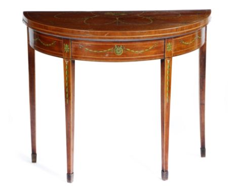 A George III mahogany demi-lune card table, with later painted decoration, with ribbon-tied swags of husks and musical trophi