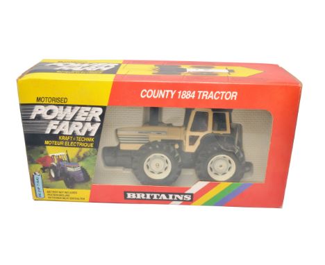Britains Powerfarm model issue comprising 1/32 County 1884 Tractor (9324), appears excellent and secure in original packaging