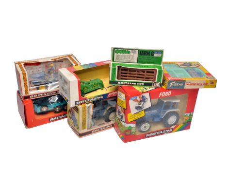 A group of Britains Farm boxed tractor and implement issues. Boxes with notable wear (exception Ford 5610). 