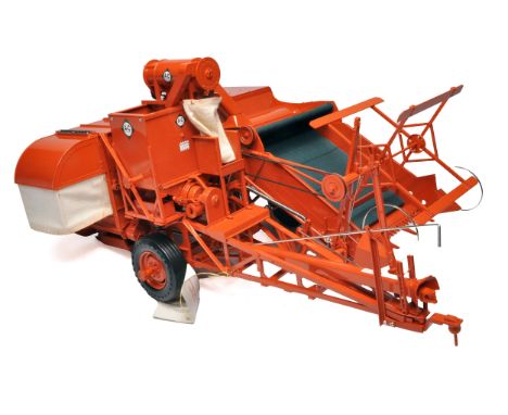 Franklin Mint diecast issue comprising 1/12 Allis Chalmers trailed Combine Harvester in original packaging. Looks to be witho