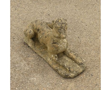 Garden Statuary; A vintage reconstituted stone Dog, modelled laying on front legs, L 66cm x W 27cm x H 21cm. 