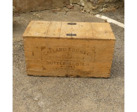 A vintage pine Callard &amp; Bowsers Butterscotch Chest, with bi-fold lid, enclosing vacant interior with metal lining, bound