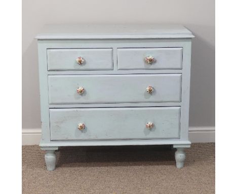 An antique painted pine Chest of Drawers, with two short and two long drawers with ceramic handles, on turned feet, W 96cm x 