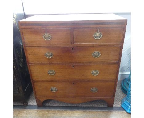 A George III mahogany Chest of Drawers, comprising of two short over three long drawers, with metal handles, on swept bracket