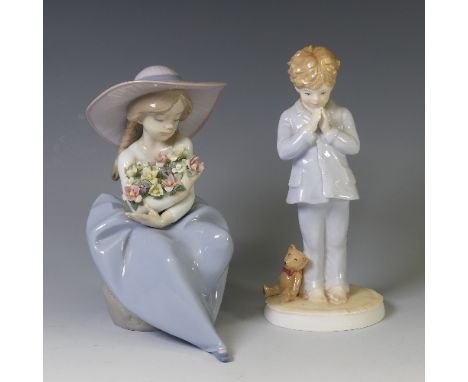 A Royal Worcester limited edition figure of Luke, 650/2000, together with a Lladro porcelain figure of a girl with flowers, e