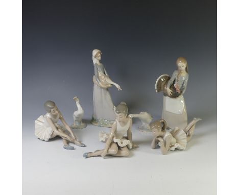 A small quantity of Lladro figurines, to include a Girl holding a goose with a lamb at her feet, a Girl carrying a turkey, tw