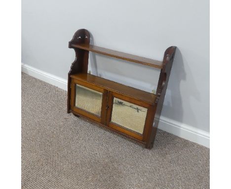 An Edwardian walnut Medicine Cabinet, with open shelf and bevelled mirrored doors, W 62cm x D 14cm x H 65cm, together with an