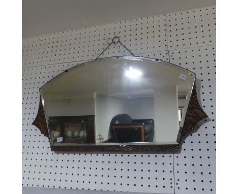 An Art Deco carved wood and bevelled glass Wall Mirror, the wooden surround carved with floral decoration, W 72cm x H 38cm. 