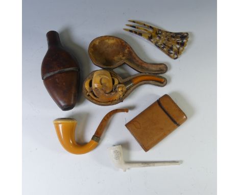 A cased white metal and amber mounted Meerschaum Pipe, in the form of a beasts claw, in fitted case, together with two other 
