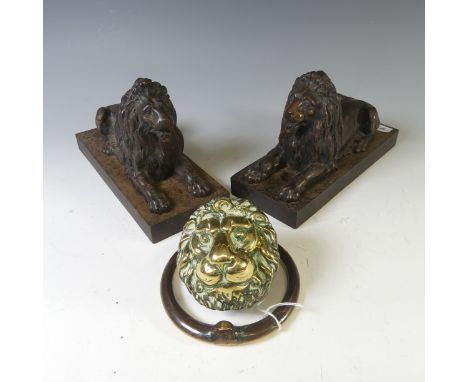 A pair of antique cast metal Fire Dogs, modelled as recumbent Lions, raised on plinth base, W 10cm x D 24cm x H 15cm, togethe