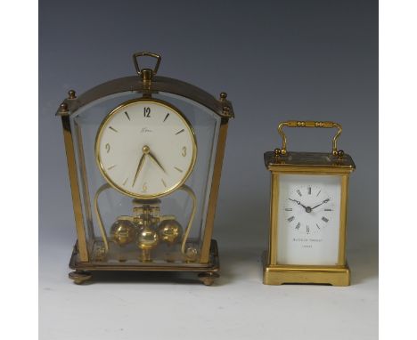 A gilt-brass Carriage Clock, of five glass form with Swiss 11-jewels movement, signed Matthew Norman, London, 14cm high handl