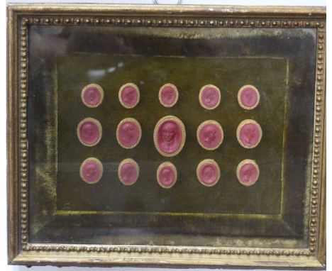 A group of fifteen Grand Tour red wax Intaglio Seals, depicting various Roman Emperors, in glazed frame, overall frame dimens