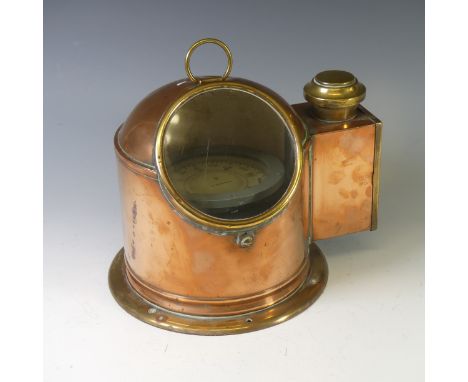 An antique copper and brass cased Ship's Binnacle, with circular glass viewing panel and with lamp box to the side, the compa
