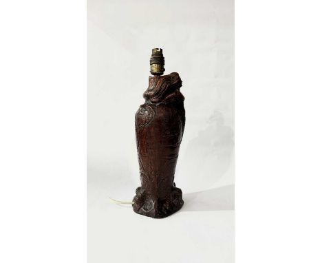 A Compton-style terracotta glazed ceramic lamp base featuring a relief mermaid with bat wings, possibly Coleorton Pottery, 40