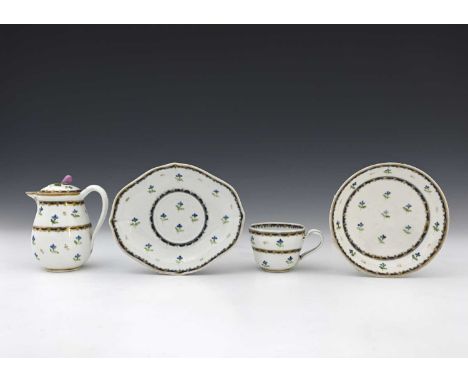A Vienna porcelain covered jug, stand, teacup and saucer, circa 1778, painted with Chantilly sprig design, underglazed blue a